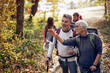 © luckybusiness - An elderly couple at hiking looking for the trail