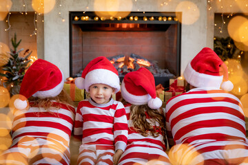 Sticker - Happy family with children near fireplace at Christmas