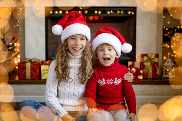 Canvas Print - Happy children near fireplace at Christmas