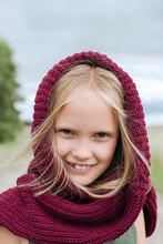 Portrait Of Smiling Blond Girl With Round Scarf
