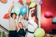 © Eugenio Marongiu/Westend61 - Happy carefree friends dancing with balloons during party at home