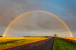© Scott Masterton/Westend61 - Double rainbow arching over empty countryside highway