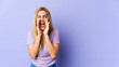 © Asier - Young blonde caucasian woman shouting excited to front.