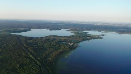 Wall Mural - A bird's-eye view of the summer lake at dawn. Drone shot at the summer lake.