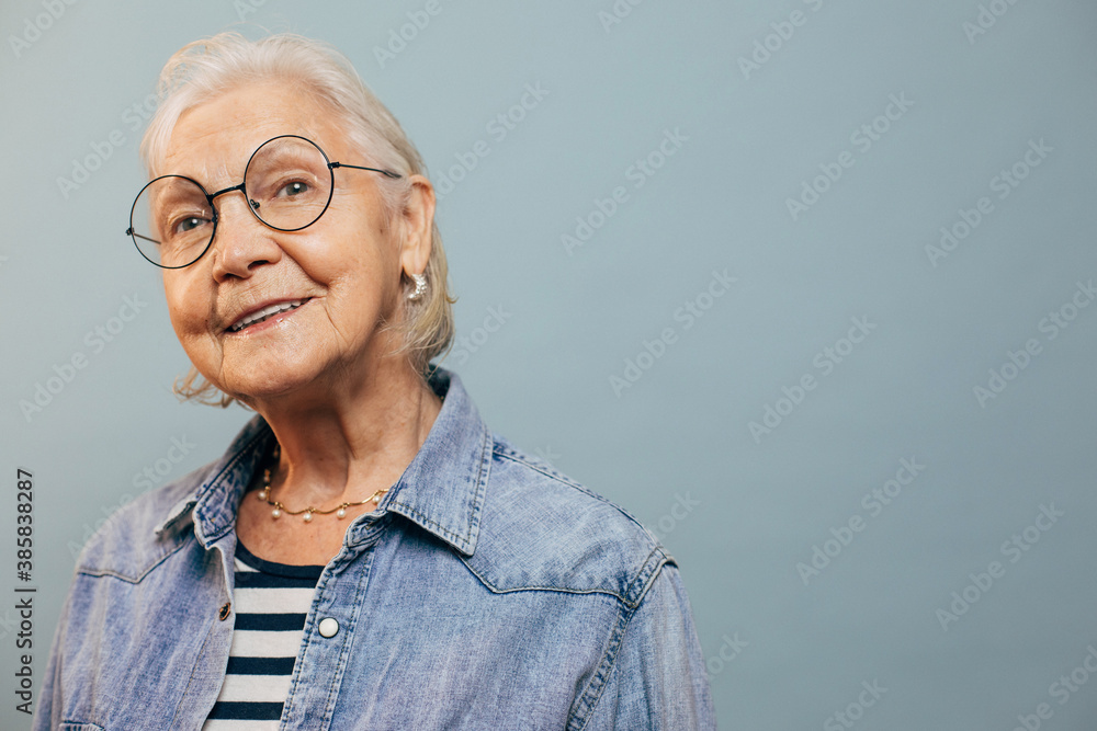 Interested confident elderly woman with short white hair and gray eyes ...