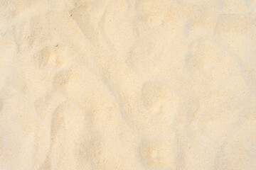 Wall Mural - Closeup shot of sand texture on the beach as nature background. Wallpaper and background concept.