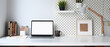 Leinwandbild Motiv Mockup blank screen laptop and office supplies on white desk.