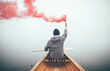 © yossarian6 - Canoeist using smoke bomb to signal his position on the foggy lake