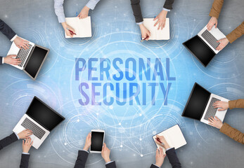 Group of people in front of a laptop with PERSONAL SECURITY insciption, web security concept