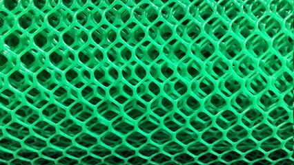 Green plastic grille pattern background.