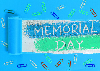 Text sign showing Memorial Day. Business photo showcasing To honor and remembering those who died in military service Rolled ripped torn cardboard placed above a wooden classic table backdrop