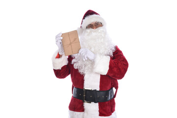 Wall Mural - Senior man wearing a traditional Santa Claus costume holding a plain brown paper wrapped gift in his hands. Isolated on white.