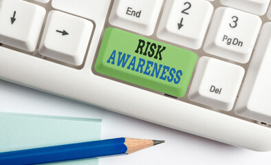 Sticker - Word writing text Risk Awareness. Business photo showcasing recognizing factors that may cause a lifethreatening effect Different colored keyboard key with accessories arranged on empty copy space