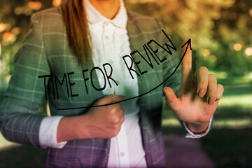 Wall Mural - writing note showing time for review. business concept for review of a system or situation in its fo