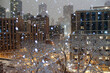 snowy storm hazy night in new york city with trees and buildings