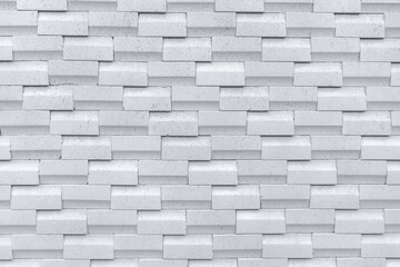 White brick wall with simple pattern. White wall texture abstract background. Modern design of brick wall background. Simple abstract wallpaper. Concrete surface texture. Exterior architecture design.