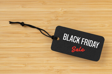 Sale tag with Black Friday written on table