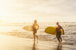 © Alessandro Biascioli - Happy friends with different age surfing together on tropical ocean - Sporty people having fun during vacation surf day - Elderly and youth people sport lifestyle concept