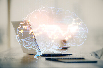 Double exposure of desktop with computer and brain drawing hologram. Artificial intelligence concept.