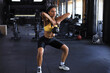 © ty - Sport woman with kettlebell in the gym.