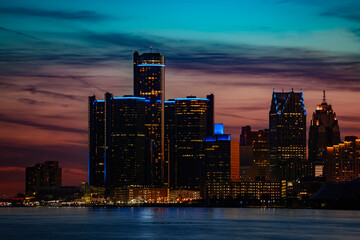 Wall Mural - Close photo of night view of Detroit downtown skyscrapers and river from sunset point of Belle Isle, Michigan USA