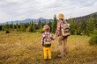 © Maygutyak - Happy family resting in the mountains in autumn