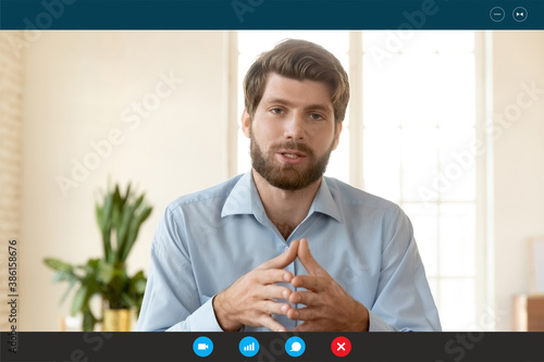 Head shot portrait screen view with app interface confident businessman speaking and looking at camera, coach mentor recording webinar, manager engaged in internet negotiations, video call concept