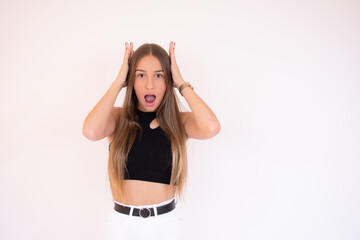 Shocked young girl over white background