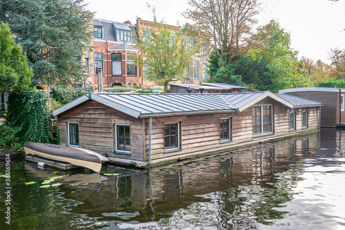 Wooden houseboats in a canal in the city of Leiden, Holland.