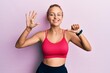 © Krakenimages.com - Beautiful caucasian woman wearing sportswear showing and pointing up with fingers number six while smiling confident and happy.