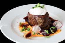 Steak With Poached Egg, Sweet Potato And Mushroom Sauce.