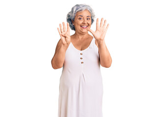 Wall Mural - Senior woman with gray hair wearing casual clothes showing and pointing up with fingers number nine while smiling confident and happy.