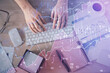 © peshkova - Multi exposure of man's hands typing over computer keyboard and forex graph hologram drawing. Top view. Financial markets concept.