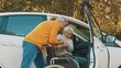 Elderly couple. Man taking care of his elderly disabled wife. High quality photo