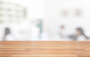 Empty wooden table and blurred modern indoor white kitchen coffee cafe background, restaurants. Ready for product montage display. template