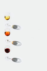 Wall Mural - Set of wine in glasses. Red, rose and white wine on light background with copy space