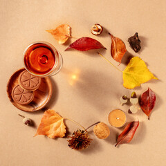 Poster - Autumn frame, square banner with dessert wine, biscuits, and autumn leaves, shot from the top with copy space on a brown background