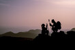 © emerald_media - Couple on the Top of Mountain at Sunset