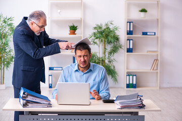 Wall Mural - Old boss and his young assistant in the office