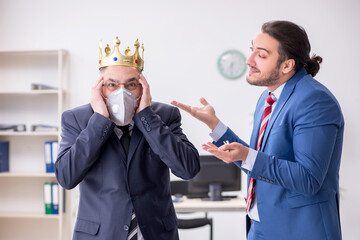 Two employees at workplace during pandemic