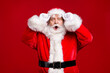 © deagreez - Photo of retire old man grey beard take off hold specs open mouth afraid forget presents home children wait wear santa costume belt gloves coat spectacles headwear isolated red color background