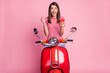 Photo of cheerful hooray young lady ride moped hold telephone dress red white t-shirt isolated on pastel pink background