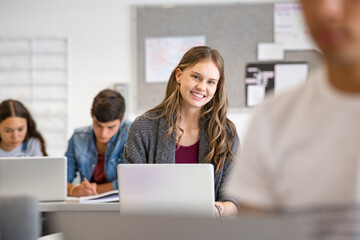 Wall Mural - Student girl using laptop in classroom