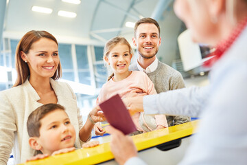 Canvas Print - Service agent at check in at the airport terminal