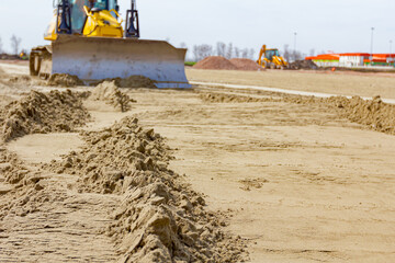 Bulldozer is leveling ground at construction site