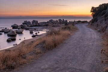 Wall Mural - dirt road over the aegean sea during sunrise