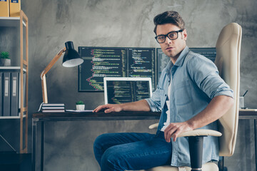 portrait of his he nice skilled expert geek guy company owner technician sitting in chair coding tas