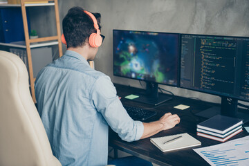 rear back behind view of his he nice focused skilled experienced guy geek practicing web development