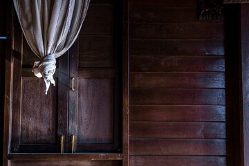 Wall Mural - Textured background: Wooden pattern of Window and White lace curtains in traditional thai house, Thai Style architecture.