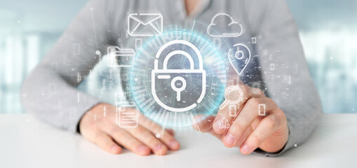 Wall Mural - businessman holding a security padlock wheel icon with multimedia and social media icon 3d rendering